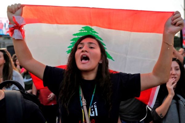 A Lebanese protester chants slogans during ongoing anti-government demonstrations in Lebanon's capital Beirut 