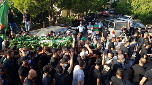 Anti Hezbollah  chants during the funeral of Amal member Hussein Khalil