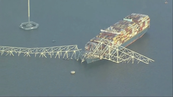 Major Baltimore bridge collapses after being hit by a cargo ship. Rescuers searching  for survivors in water